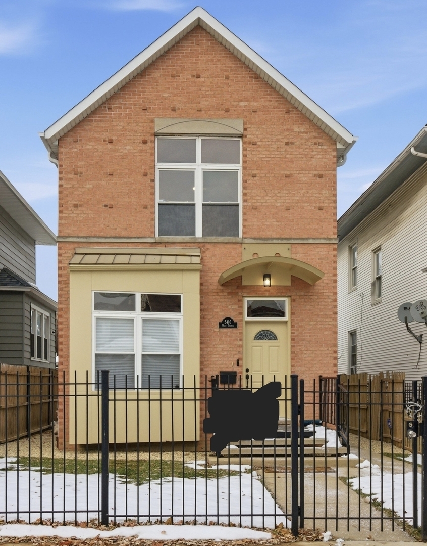 a front view of a house with a glass door