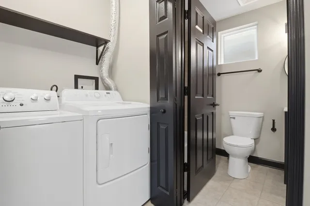 an empty room with windows and entrance