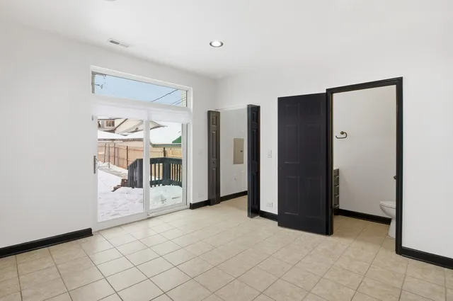 a bathroom with a sink toilet and a mirror