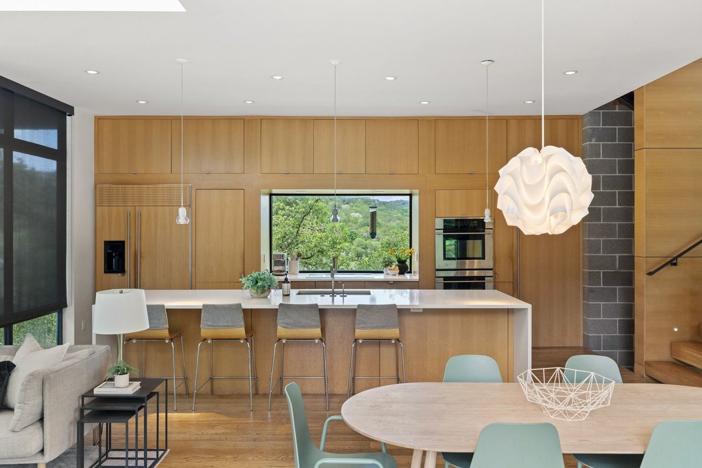 801 The High Road Austin, TX 78746 - Photo 2 of 40 a view of a dining room with furniture window and outside view