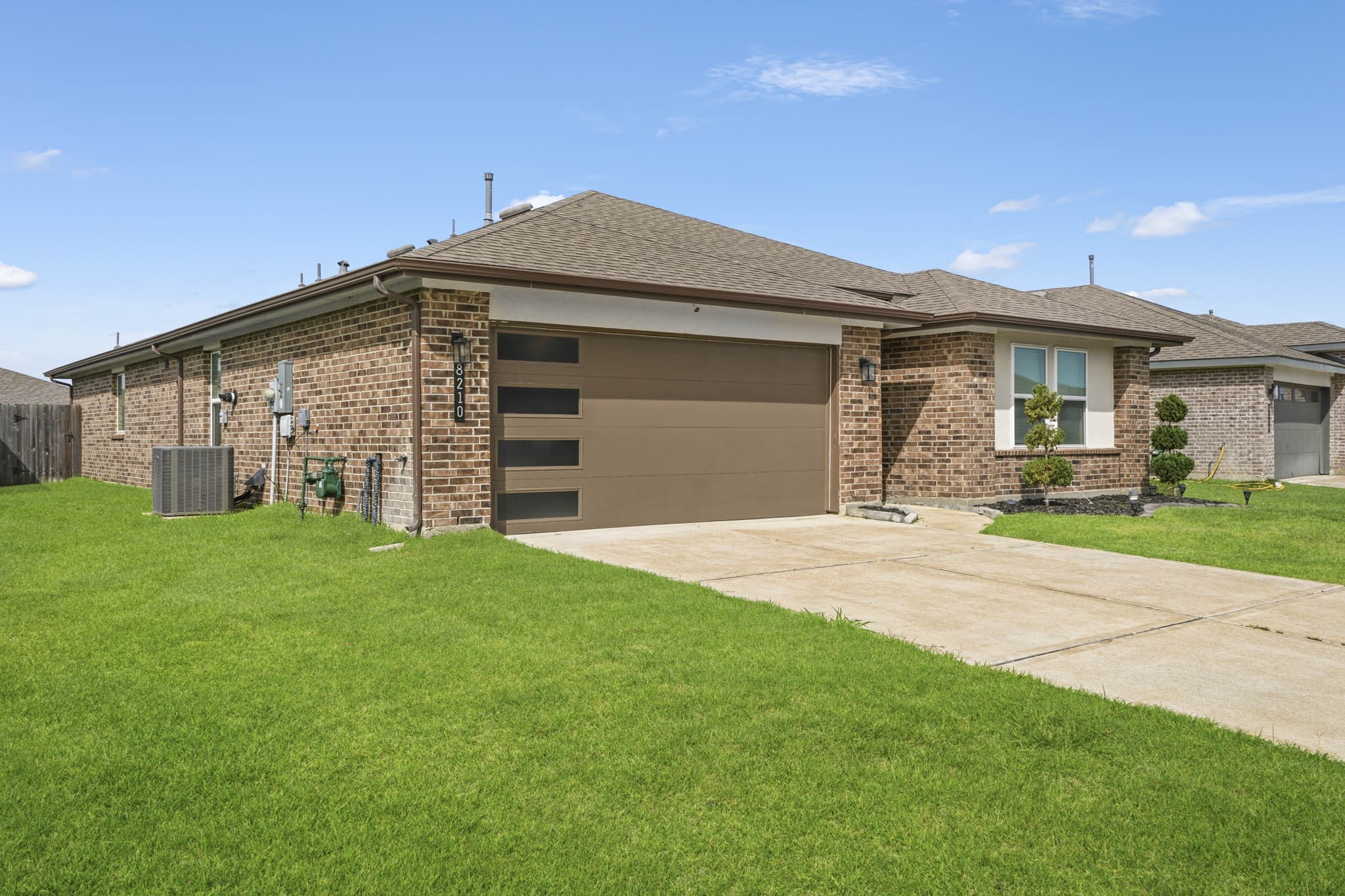8210 Buck Lane Rosharon, TX 77583 - Photo 3 of 30 Inviting front exterior featuring clean landscaping and great curb appeal.