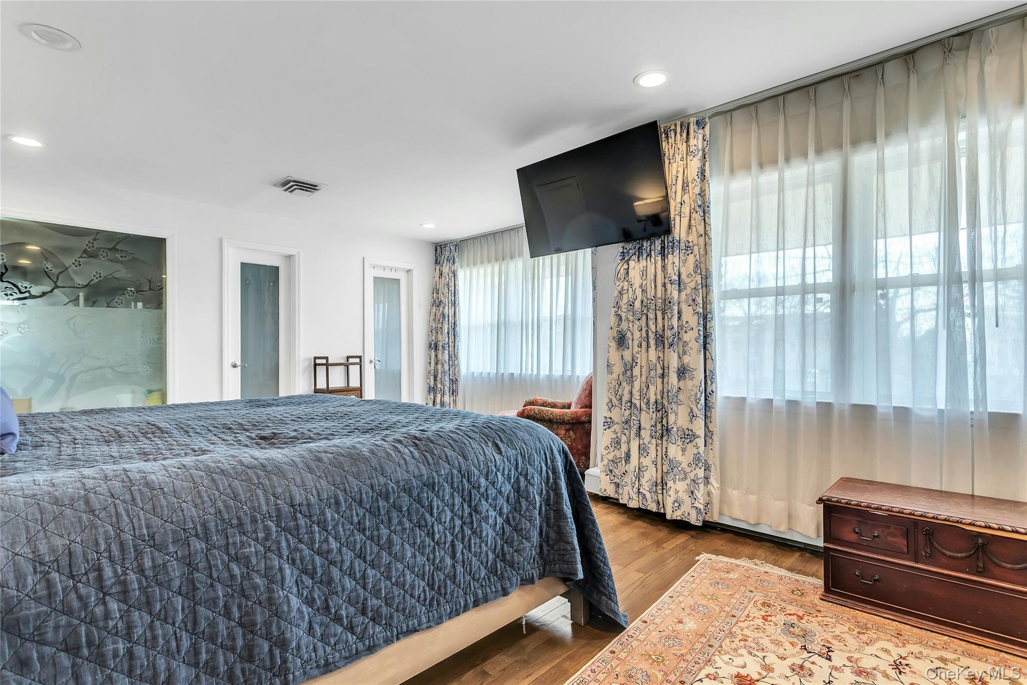 170 Old Courthouse Road Manhasset Hills, NY 11040 - Photo 19 of 35 Primary Bedroom En-suite, hardwood floors, walk-in closet, closet built-in's