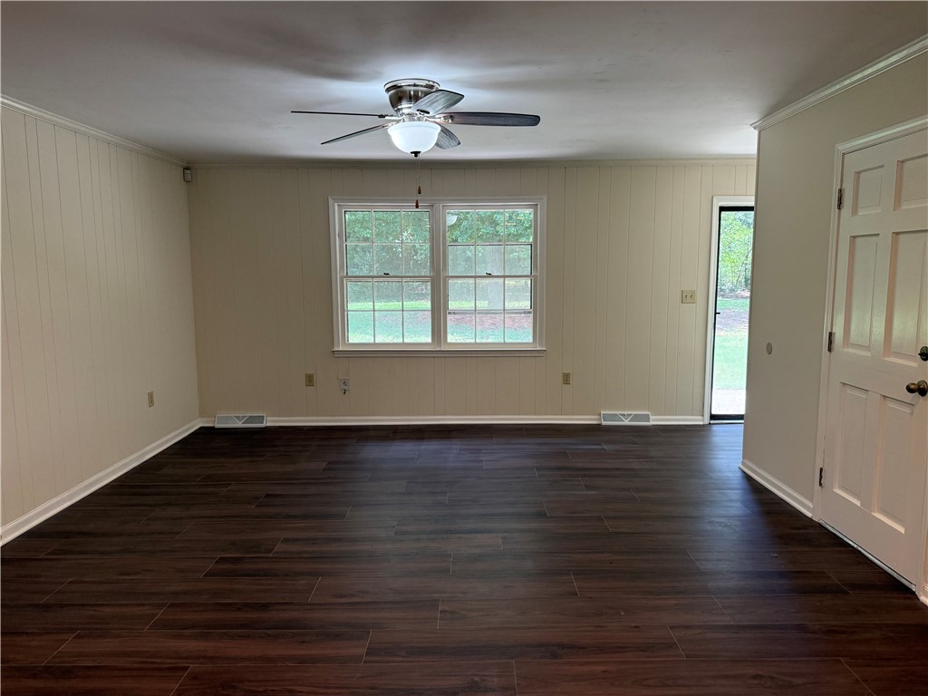 1507 East Calhoun Street Anderson, SC 29621 - Photo 7 of 18 Rich wood-look flooring and ample natural light fill this welcoming interior space.