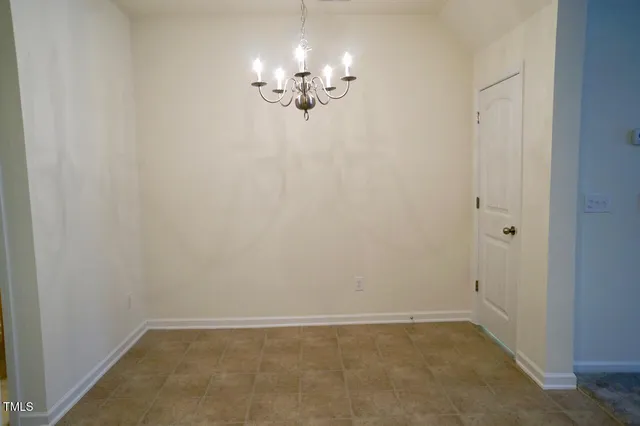 a view of a chandelier in big room