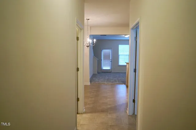 a view of a bathroom from a hallway