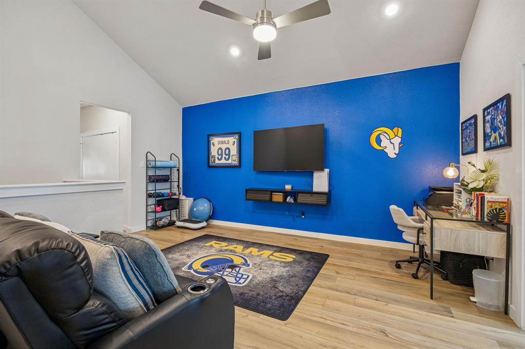 2357 Rook Drive Dallas, TX 75211 - Photo 7 of 28 a bedroom with furniture and a flat screen tv
