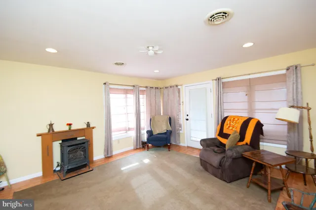 a living room with furniture and a lamp