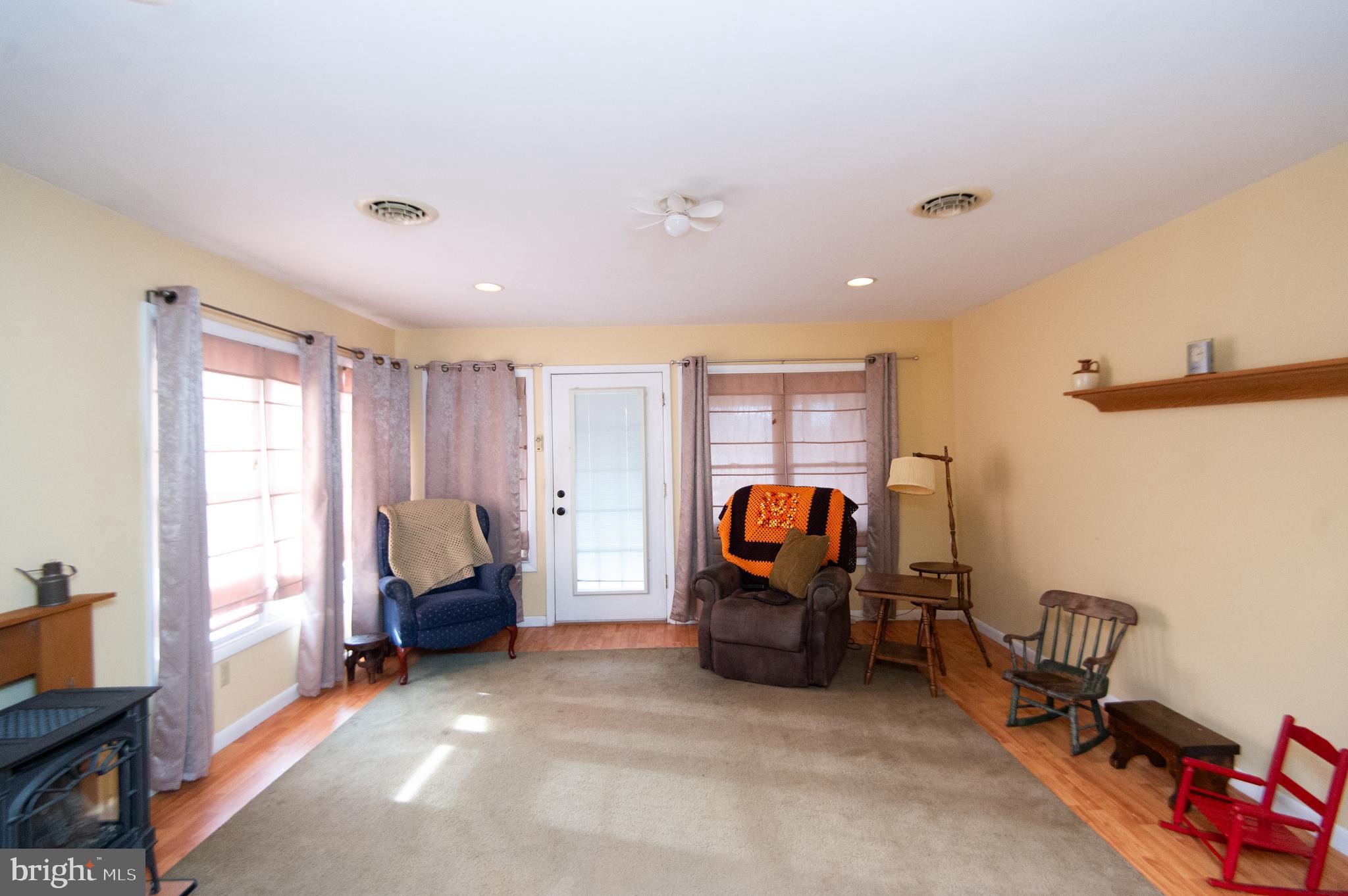 6132 Palmer Mill Road Hurlock, MD 21643 - Photo 14 of 37 a view of living room with furniture and gym equipment
