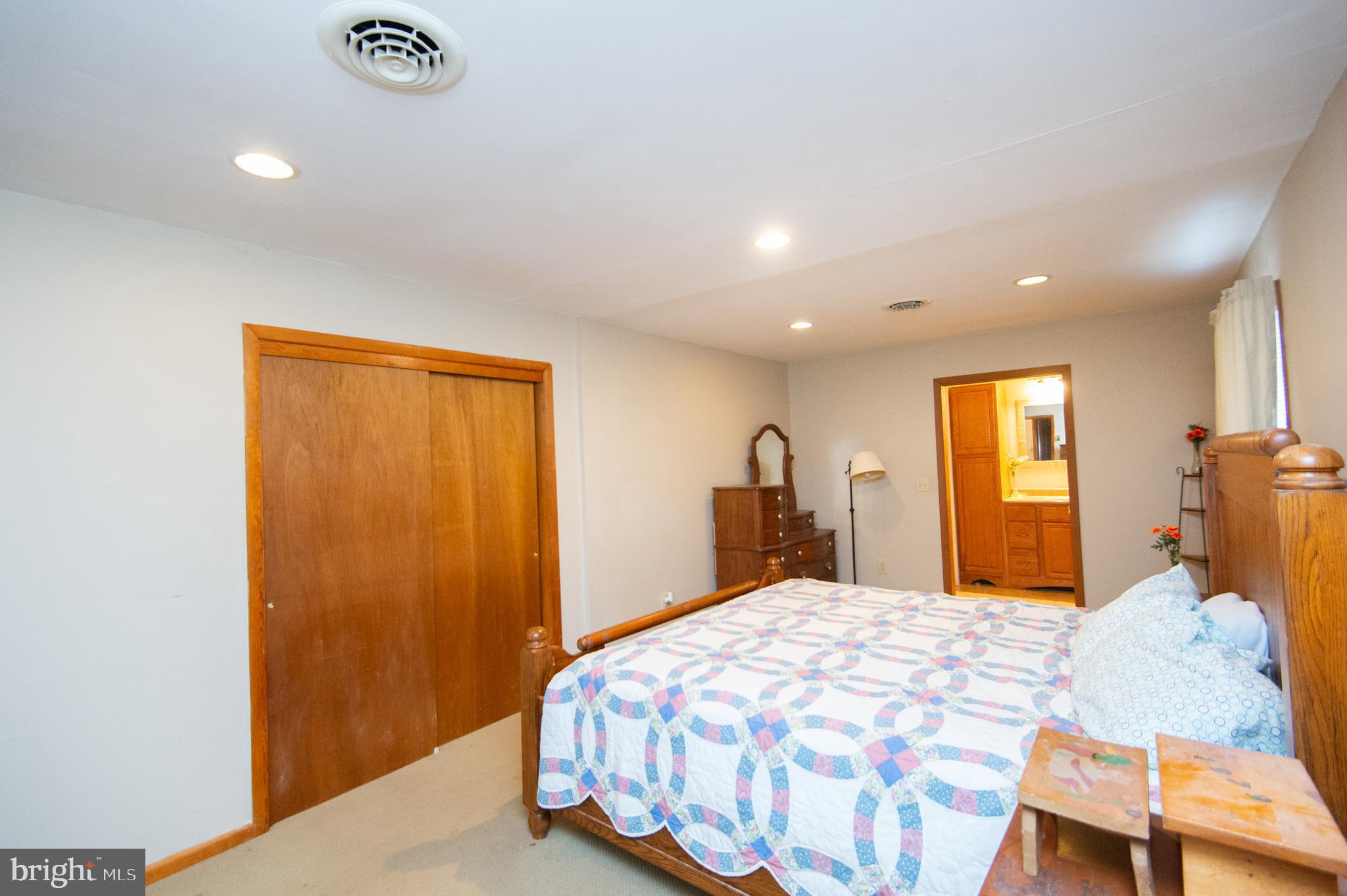 6132 Palmer Mill Road Hurlock, MD 21643 - Photo 16 of 37 a bedroom with a bed and a closet