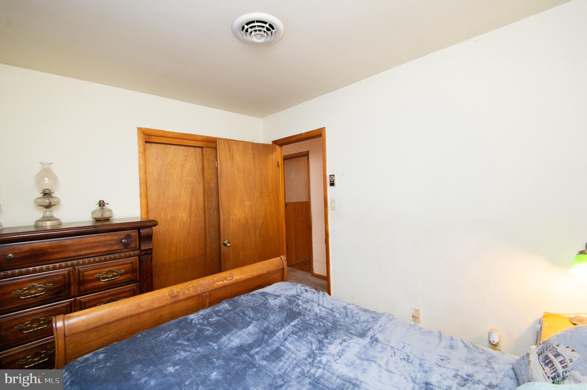 6132 Palmer Mill Road Hurlock, MD 21643 - Photo 23 of 37 a bedroom with a bed and a dresser