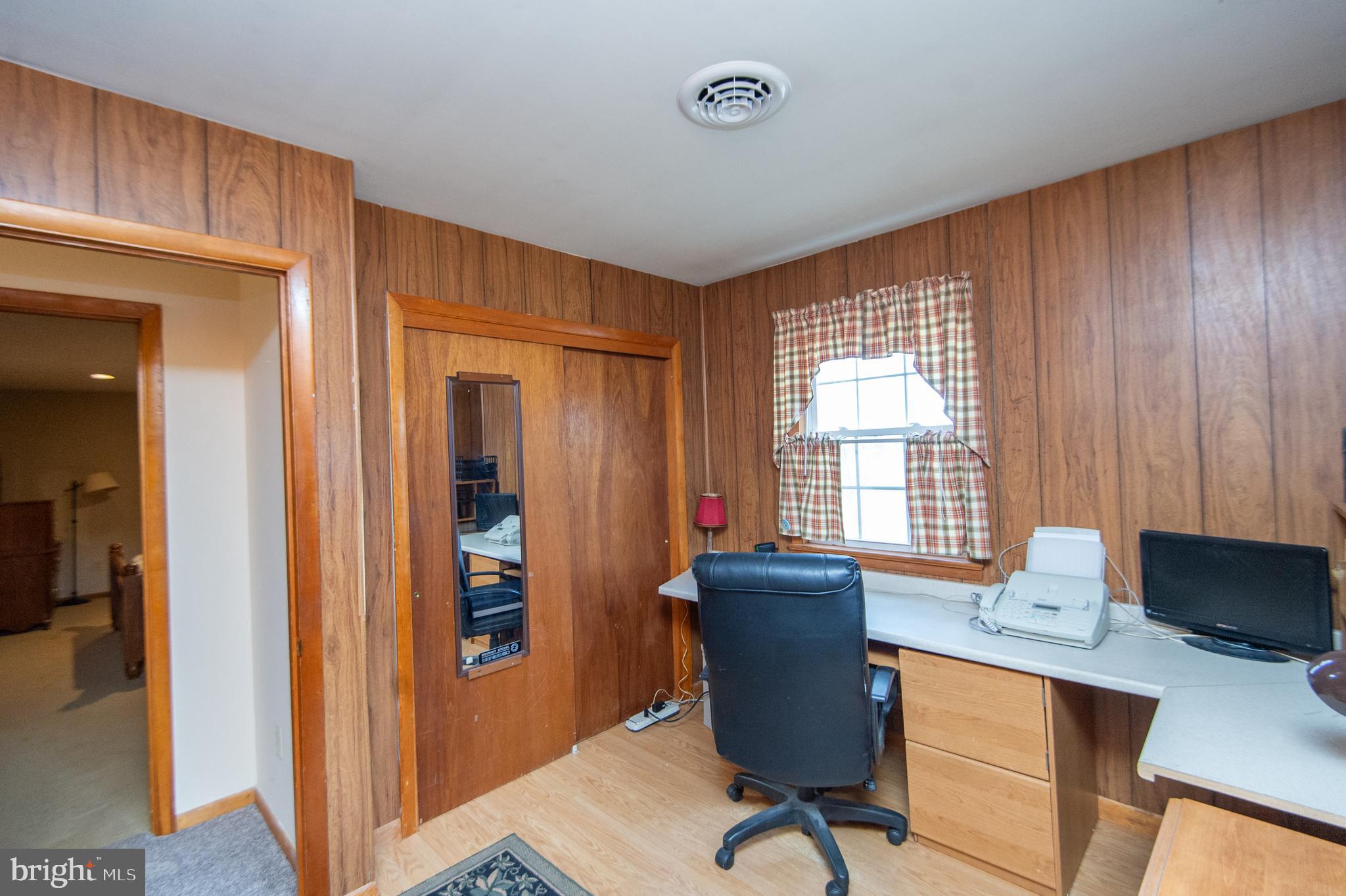 6132 Palmer Mill Road Hurlock, MD 21643 - Photo 25 of 37 a view of a workspace with furniture and a window