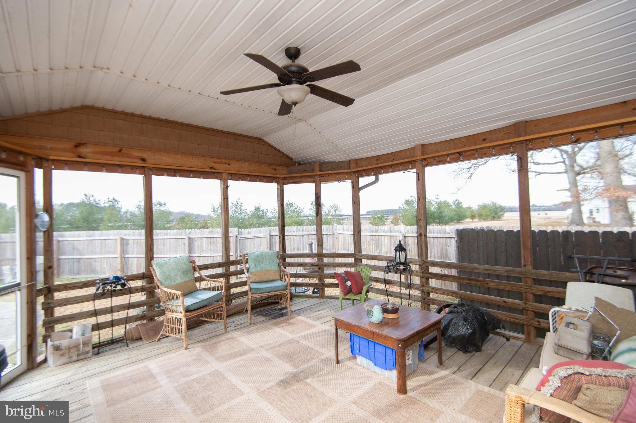 6132 Palmer Mill Road Hurlock, MD 21643 - Photo 26 of 37 a living room with furniture and a floor to ceiling window