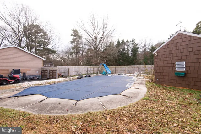 a front view of house with outdoor seating area
