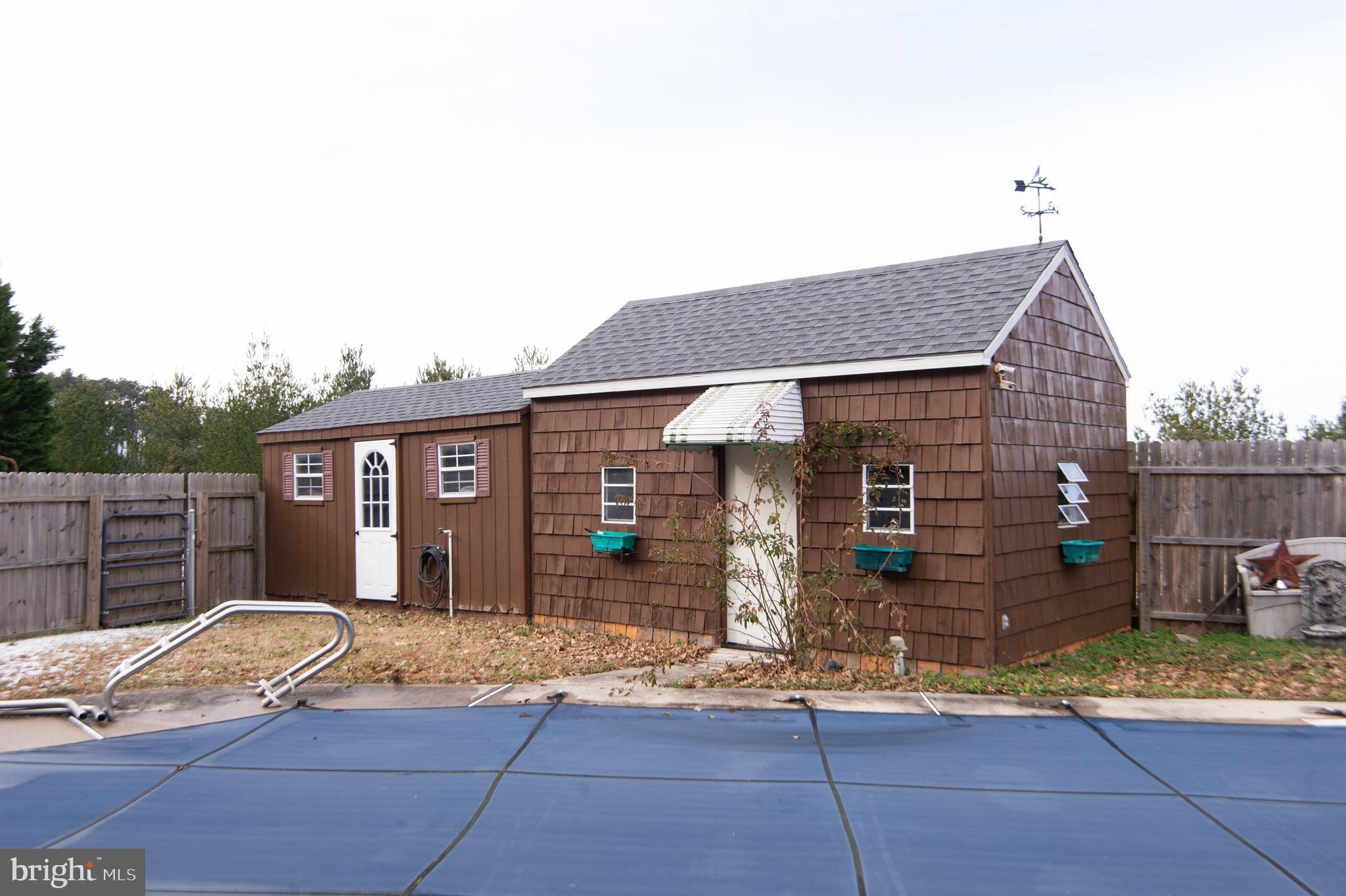 6132 Palmer Mill Road Hurlock, MD 21643 - Photo 31 of 37 a front view of a house with garden