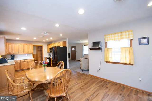 a view of a dining room with furniture and window