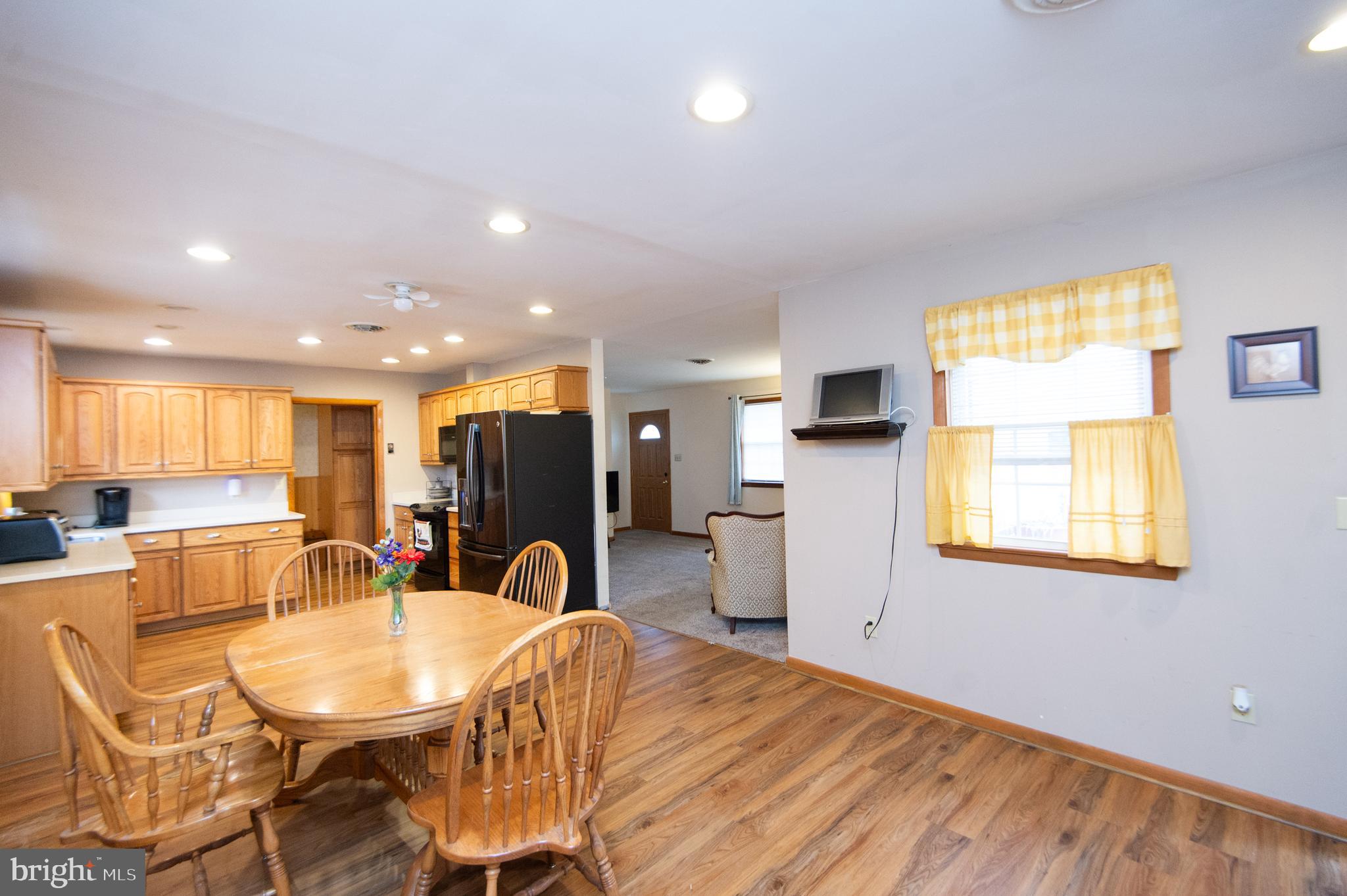 6132 Palmer Mill Road Hurlock, MD 21643 - Photo 7 of 37 a view of a dining room with furniture and window