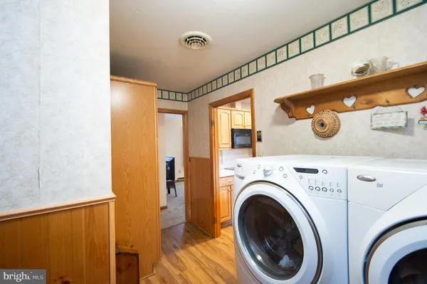 a view of a hallway with washer and dryer