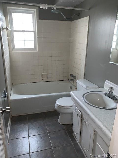 904 McAlway Road Charlotte, NC 28211 - Photo 3 of 9 a bathroom with a sink a toilet and tub