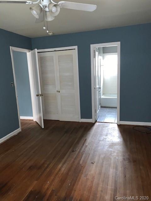 904 McAlway Road Charlotte, NC 28211 - Photo 4 of 9 wooden floor in an empty room with a window