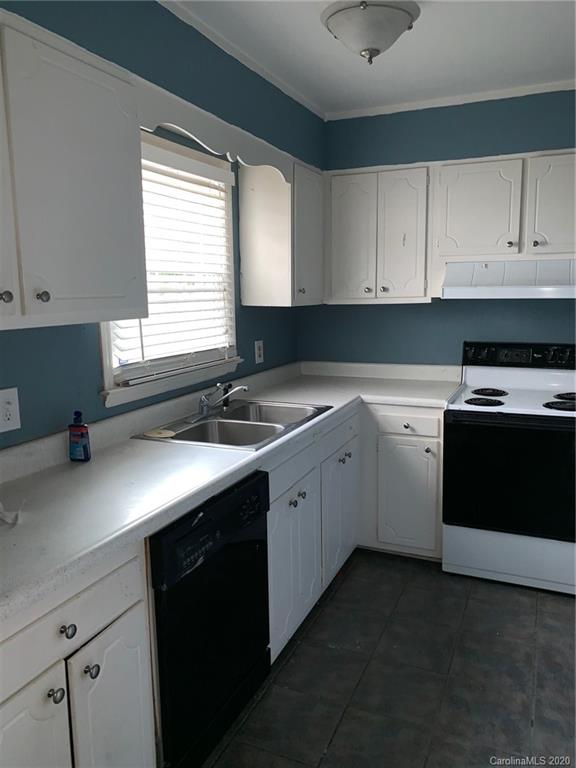 904 McAlway Road Charlotte, NC 28211 - Photo 7 of 9 a kitchen with a sink stove and cabinets