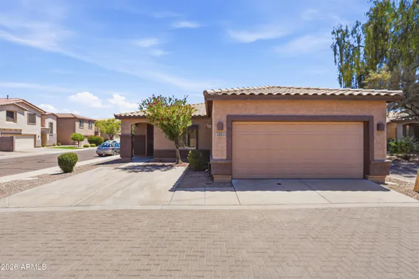 a front view of a house with a garage