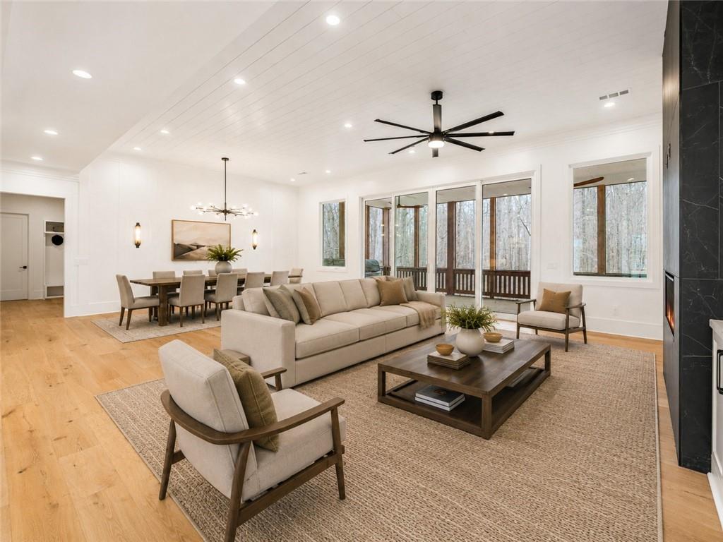 555 Lower Birmingham Road Canton, GA 30115 - Photo 37 of 104 a living room with furniture ceiling fan and a rug
