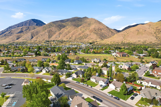 1816 River Bottom Road Springville, UT 84663 - Photo 35 of 37 Expansive mountain scenery framing a residential community with mature trees and a paved parking area