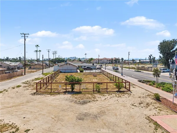 an aerial view of a swimming pool with outdoor seating