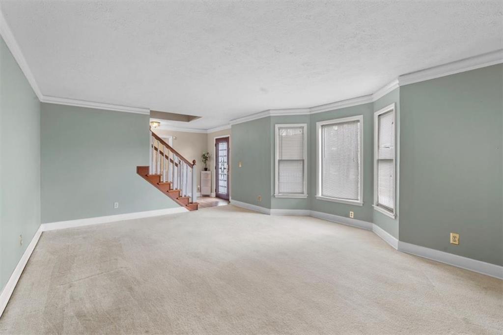783 Pine Ridge Drive Stone Mountain, GA 30087 - Photo 12 of 32 a view of an empty room with a window