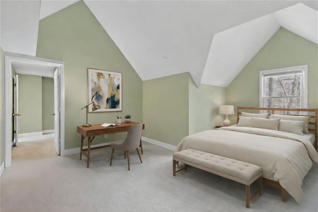 783 Pine Ridge Drive Stone Mountain, GA 30087 - Photo 16 of 32 a bedroom with a bed and a table