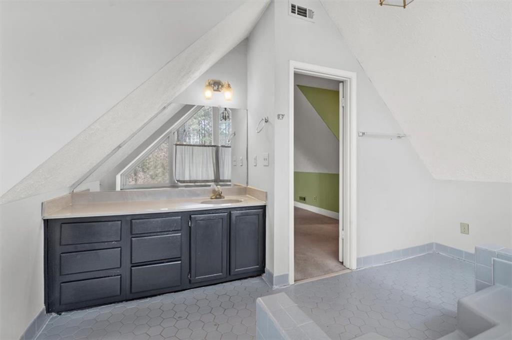 783 Pine Ridge Drive Stone Mountain, GA 30087 - Photo 19 of 32 hallway view with wooden floor and cabinet