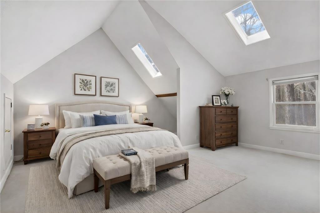 783 Pine Ridge Drive Stone Mountain, GA 30087 - Photo 20 of 32 a spacious bedroom with a bed window and a table