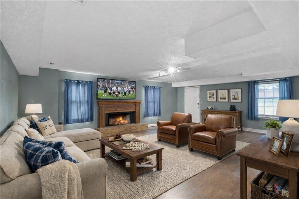 783 Pine Ridge Drive Stone Mountain, GA 30087 - Photo 22 of 32 a living room with furniture and a fireplace