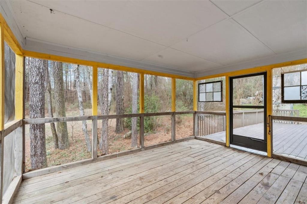 783 Pine Ridge Drive Stone Mountain, GA 30087 - Photo 27 of 32 a view of empty room with wooden floor and fan