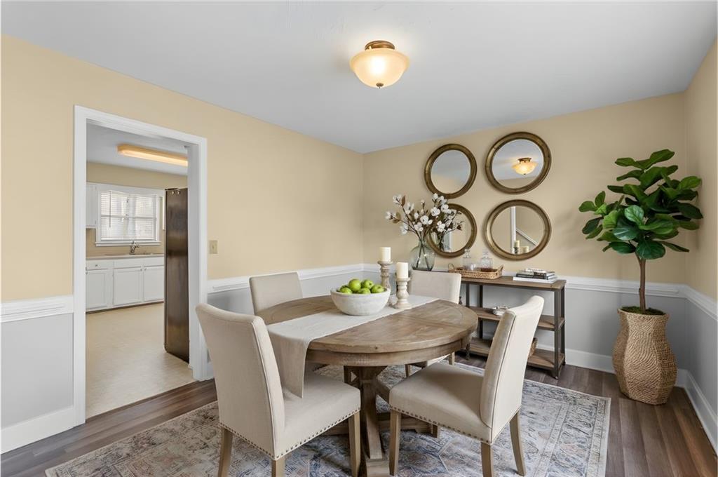 783 Pine Ridge Drive Stone Mountain, GA 30087 - Photo 3 of 32 a view of a dining room with furniture and wooden floor