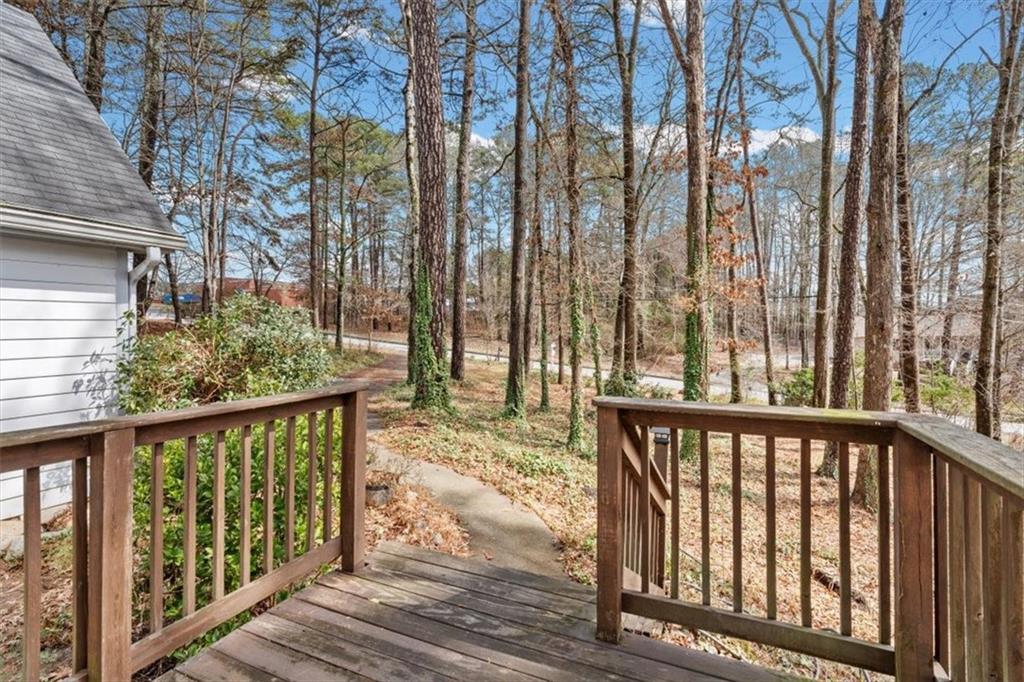 783 Pine Ridge Drive Stone Mountain, GA 30087 - Photo 9 of 32 a view of a wooden balcony and trees