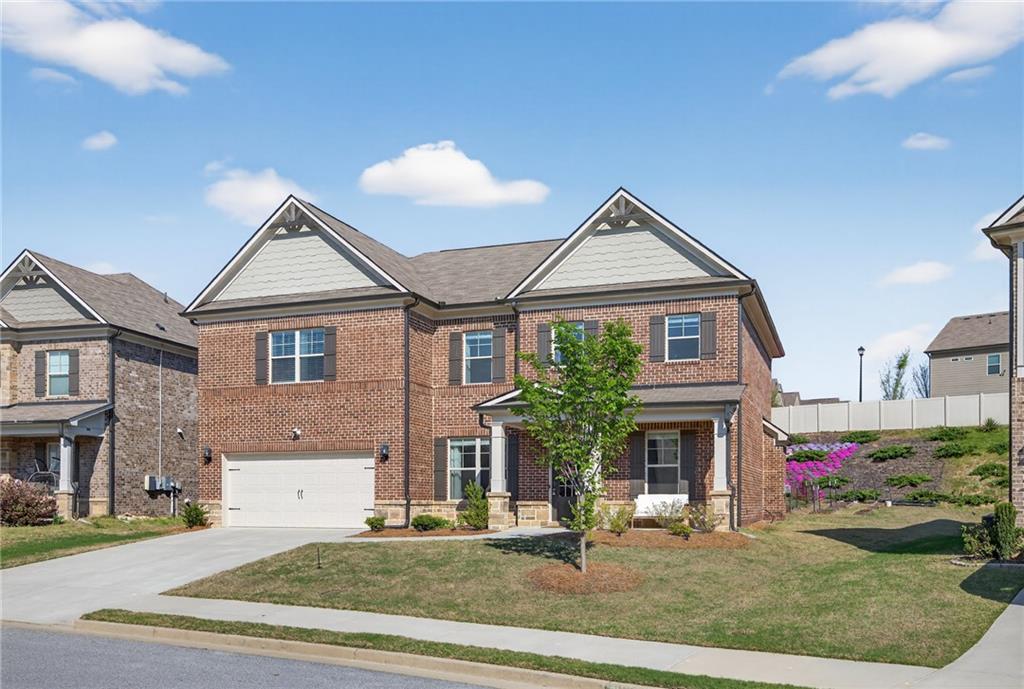 3586 Andover Way Buford, GA 30519 - Photo 2 of 63 a front view of a house with garden