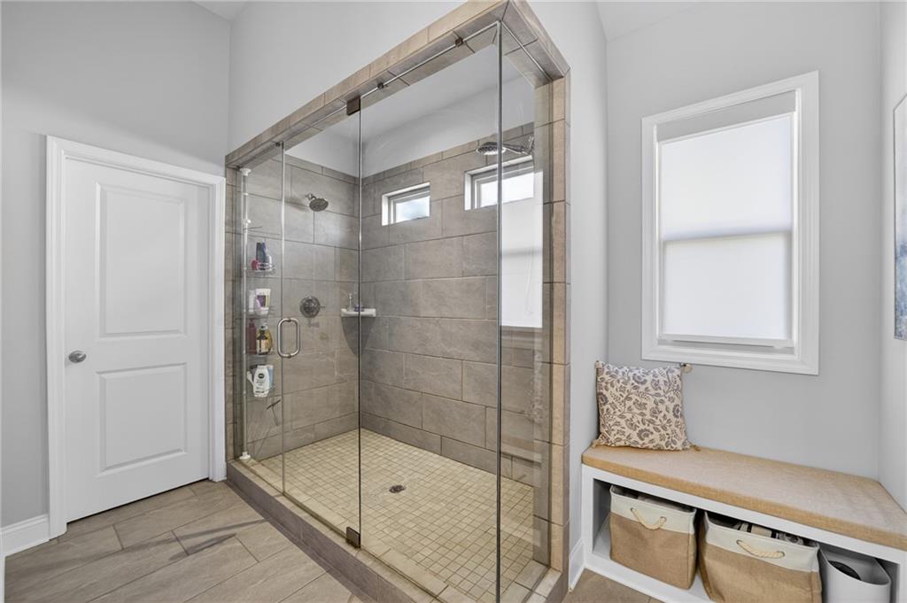 3586 Andover Way Buford, GA 30519 - Photo 28 of 63 a bathroom with a shower and a sink