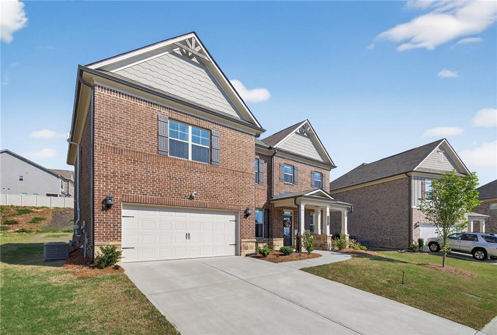 3586 Andover Way Buford, GA 30519 - Photo 44 of 63 a front view of a house with a yard