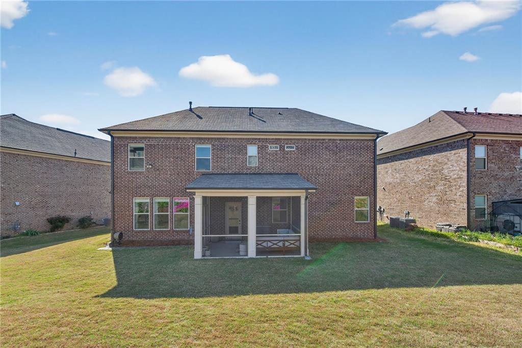3586 Andover Way Buford, GA 30519 - Photo 49 of 63 a front view of a house with a yard