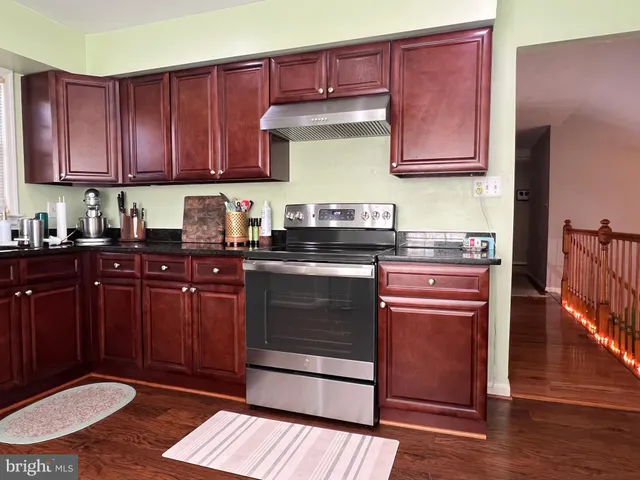 a dining room filled with furniture and chandelier