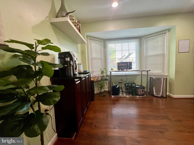 a view of a house with deck and wooden floor