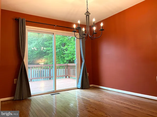 an empty room with a empty space and a window