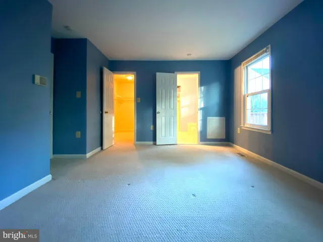 a bathroom with a tub and a window