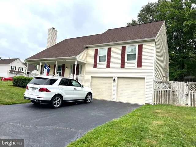 a car parked in front of a house
