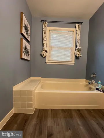 a bathroom with a shower and a bathtub