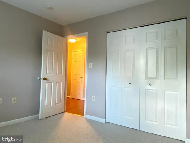 a bathroom with a sink shower and a mirror
