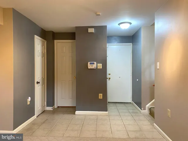 a view of a backyard with a deck and furniture