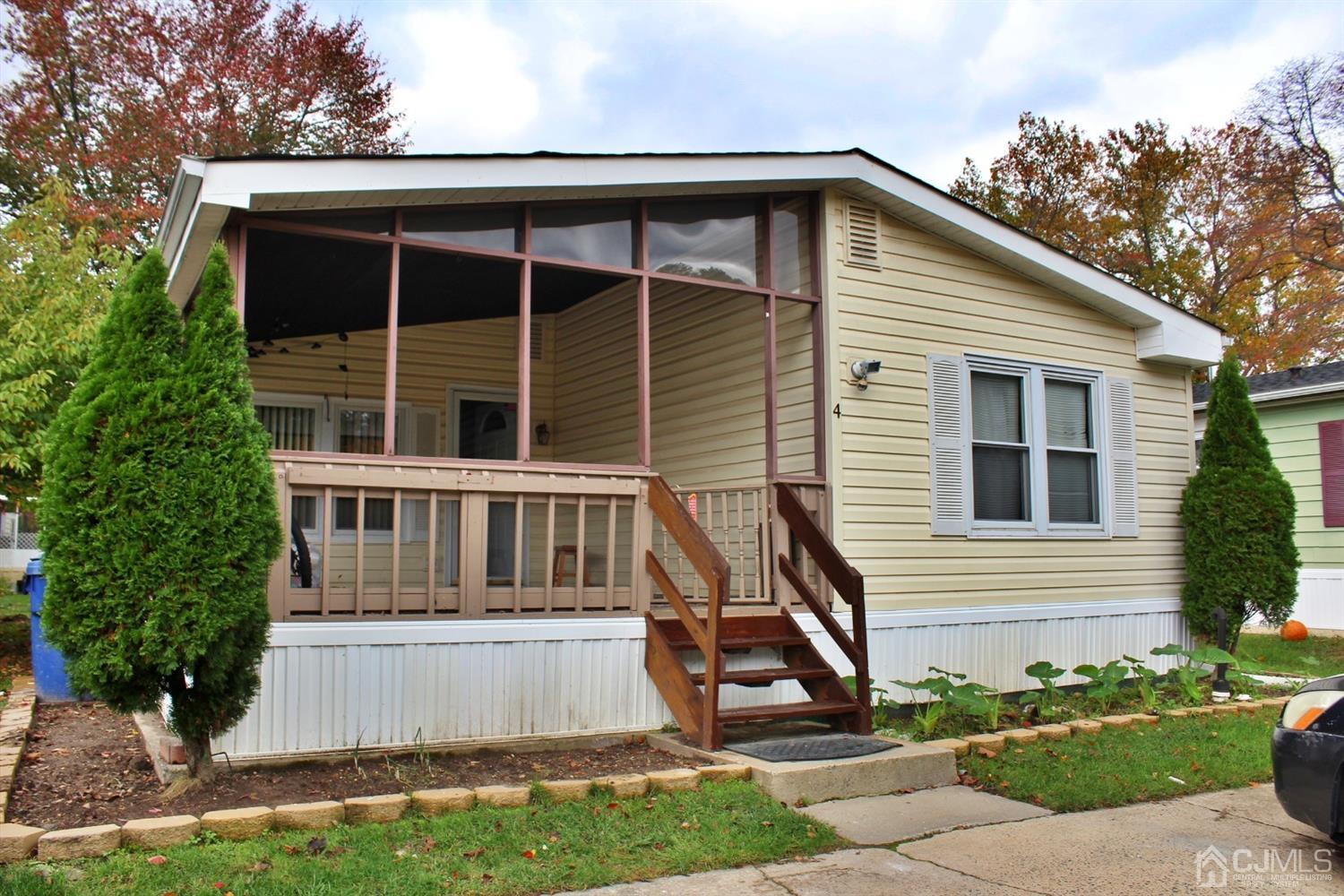 4 Longfellow Road North Brunswick, NJ 08902 - Photo 1 of 10 a front view of a house with a yard