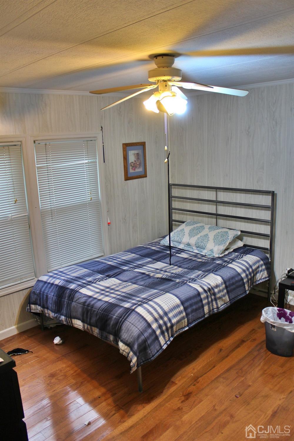 4 Longfellow Road North Brunswick, NJ 08902 - Photo 8 of 10 a bedroom with a bed and chandelier